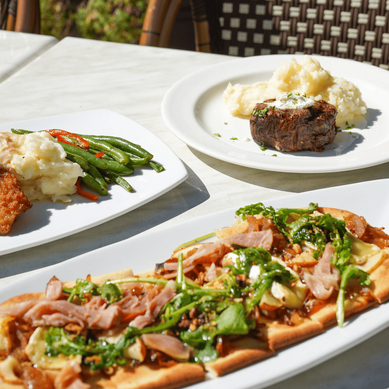 Plates of food from MTM Tavern | Steakhouse