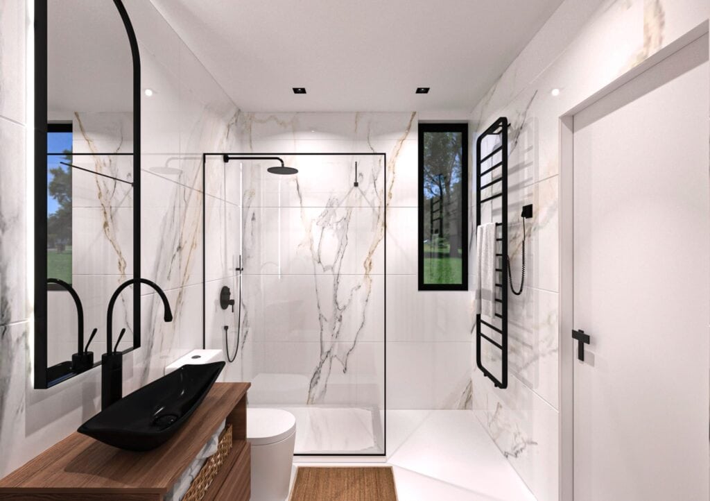 Baño moderno con ducha, lavabo y espejo.