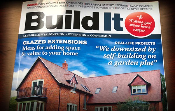 Build It magazine cover showcasing a brick house with a modular loft extension.