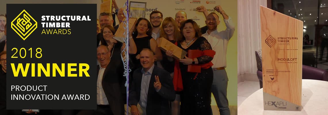 Group of people celebrating with award at Structural Timber Awards 2018.