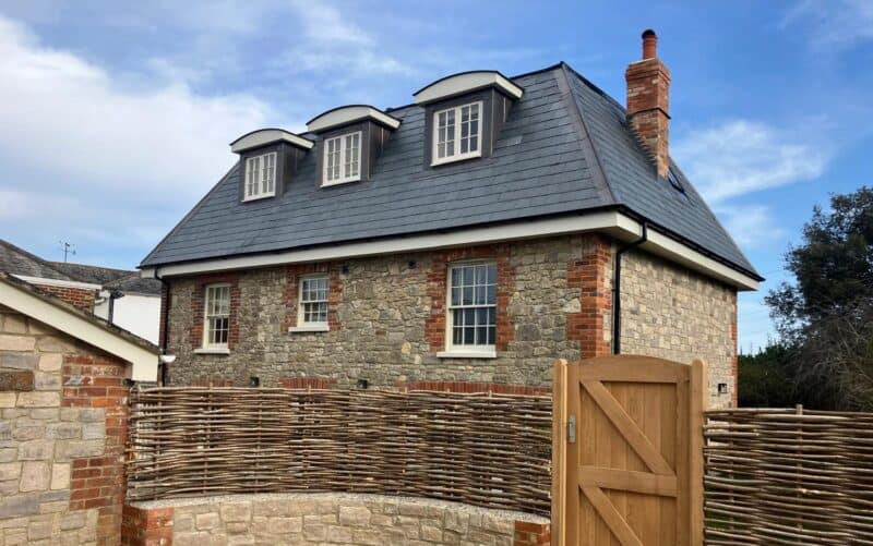 Detached property with a mansard loft conversion.