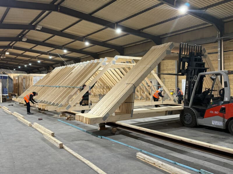 1. Workers assembling a Lofts main truss structure.