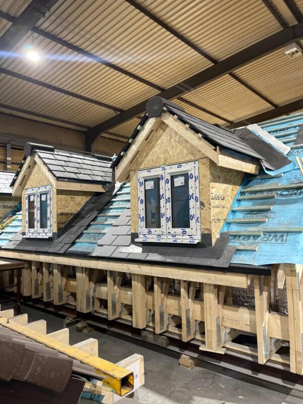 11. Our roofing teams commence tiling alongside our window fitting teams.