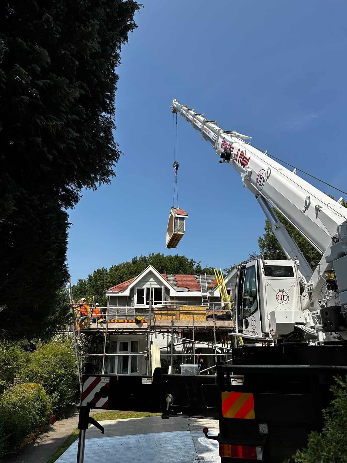 A Moduloft module being craned onto a home