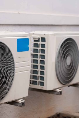 air-conditioners-mounted-on-wall-outdoors-2023-11-27-05-27-47-utc-scaled.jpg