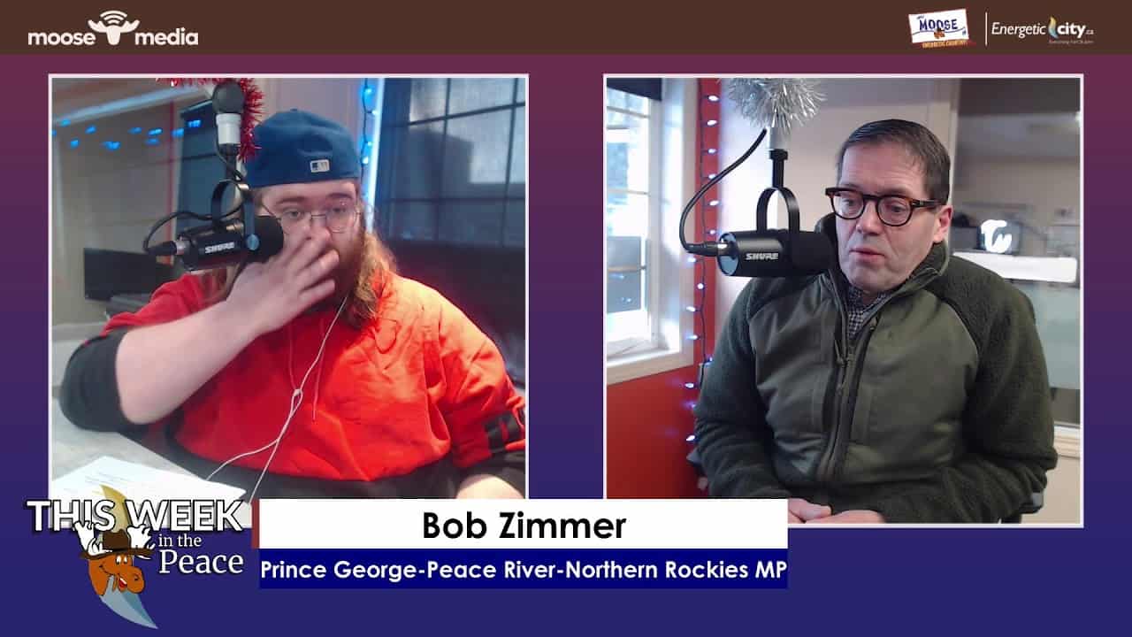 High-quality image of two men participating in a radio interview at Moose Media, showcasing local media production services.