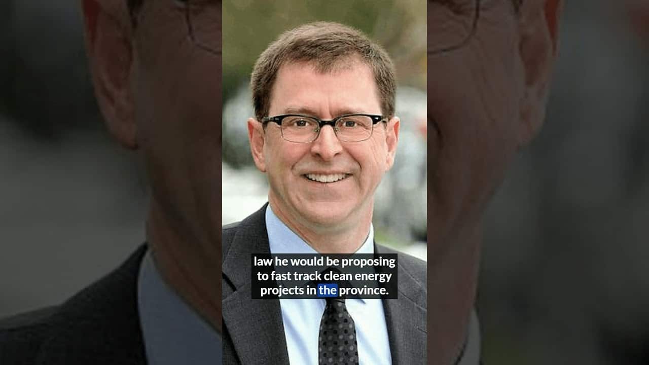 Professional man in suit promoting clean energy projects in the province.