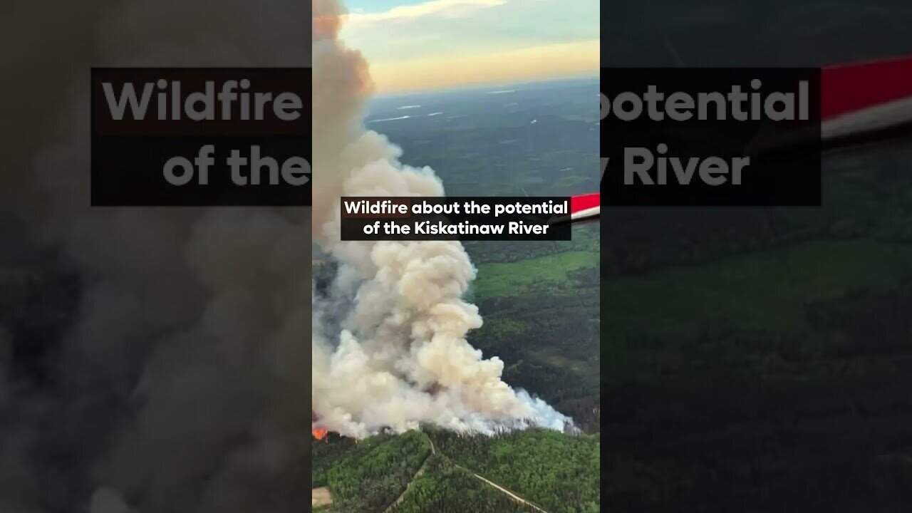 Wildfire smoke over green forests near Kiskatinaw River.