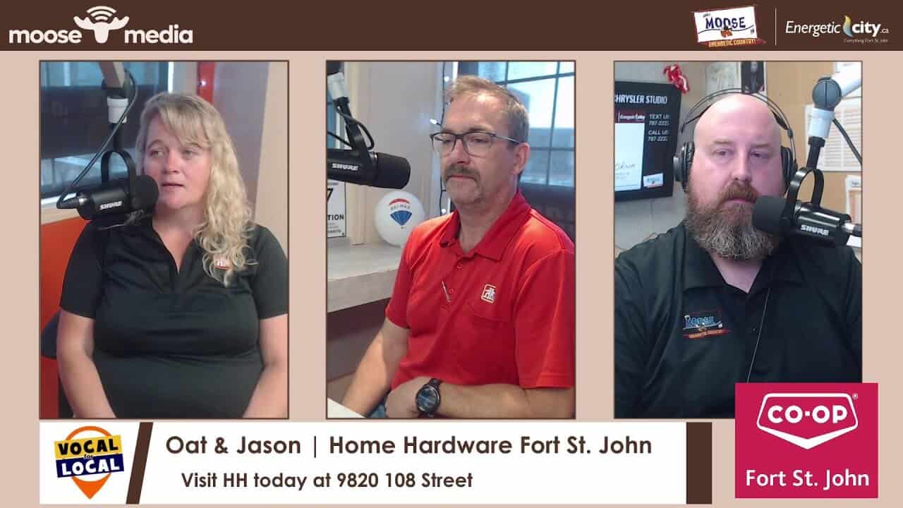 Microphone and radio hosts at MooseMedia Fort St. John recording studio.