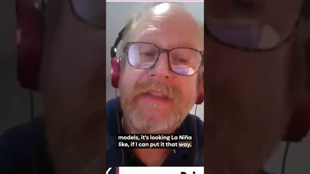 Video of man speaking with headphones and glasses.