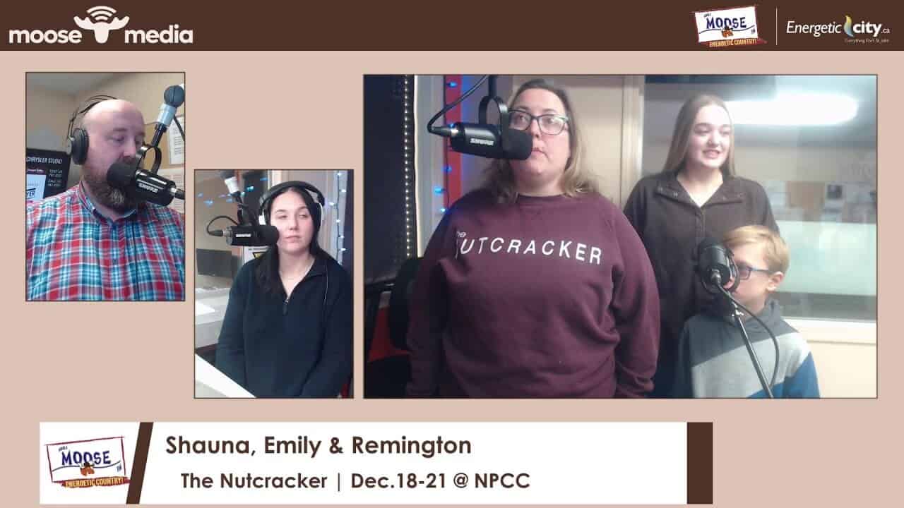 Alt text: Group of people speaking into microphones during radio recording at MooseMedia studio.