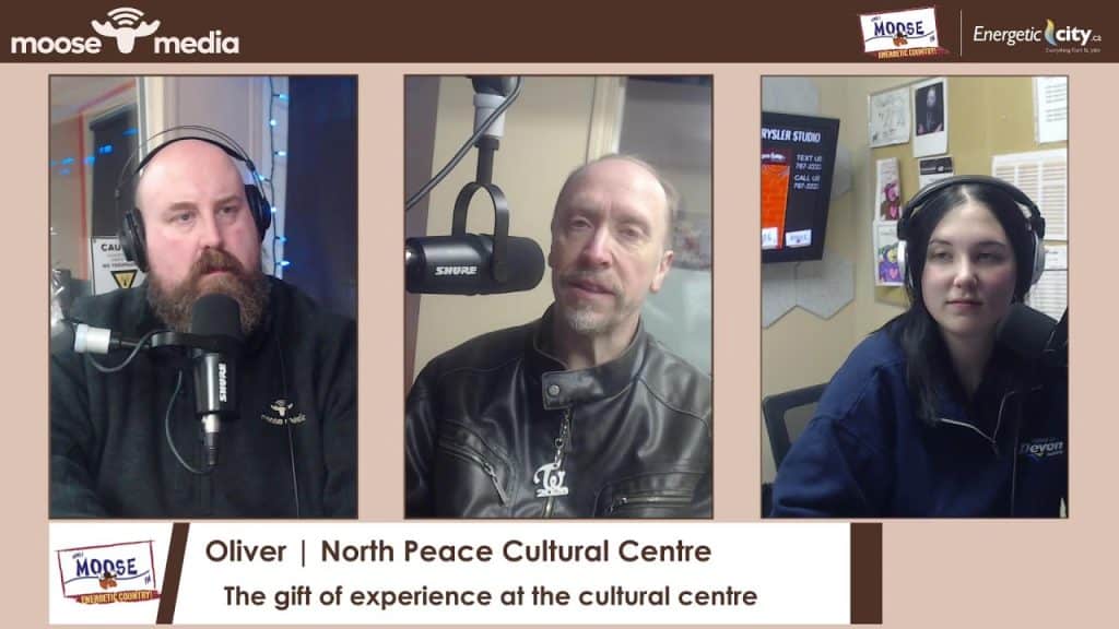 Podcast recording studio with hosts.