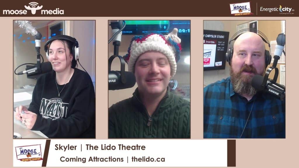 Radio hosts in festive attire broadcasting live for MooseMedia in Fort St. John.