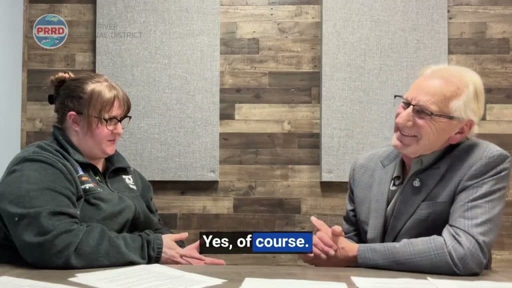 Friendly conversation at MooseMedia studio about community projects.