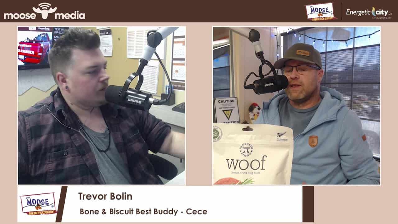 Trevor Bolin at Bone and Biscuit with Cece, a happy dog, during the Best Buddy event.