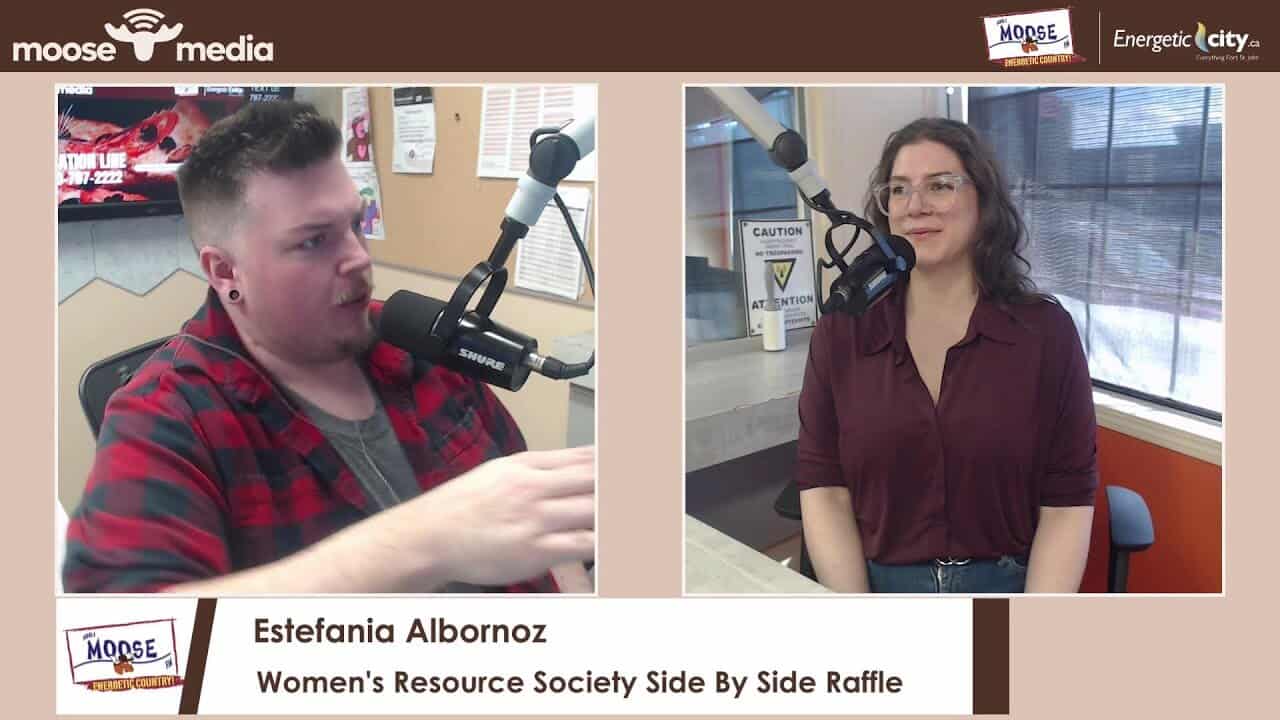 Women speaking into microphones during the Side By Side Raffle event.