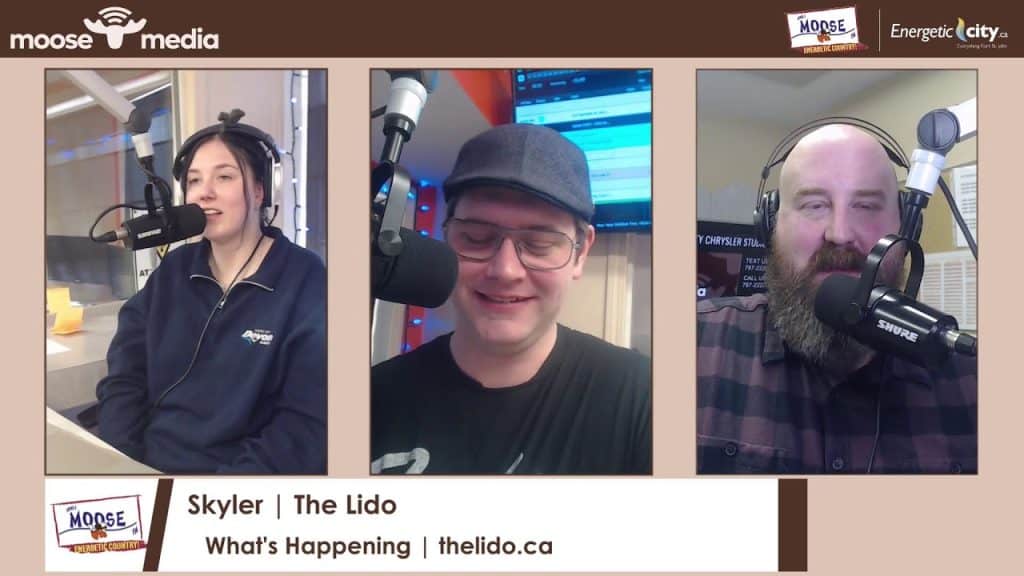 Radio hosts speaking into microphones during a live broadcast at The Lido.