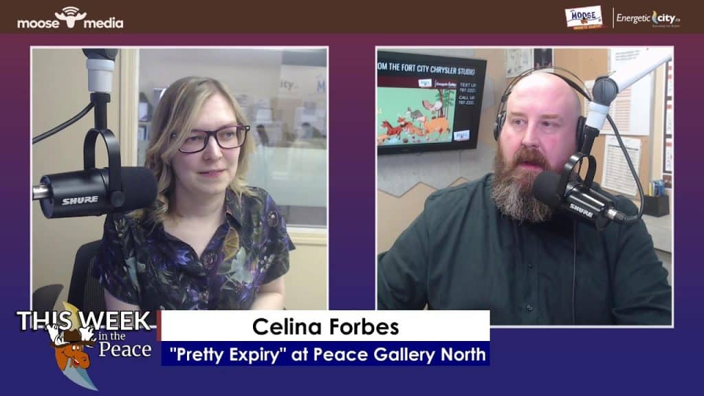 Radio hosts discussing community arts and events in Peace City.