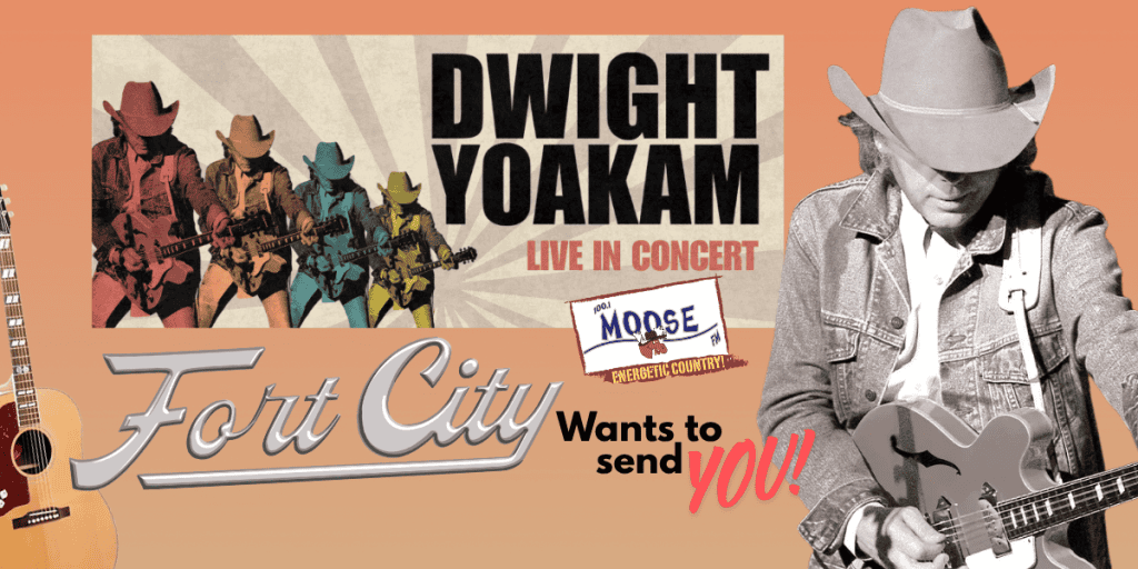 Dwight Yoakam performing live with guitar at a concert in Fort City.