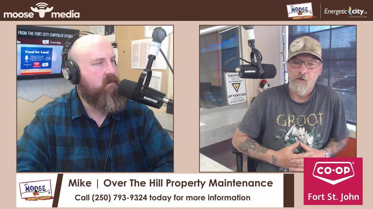 Over The Hill Property Maintenance team discussing local property care services.
