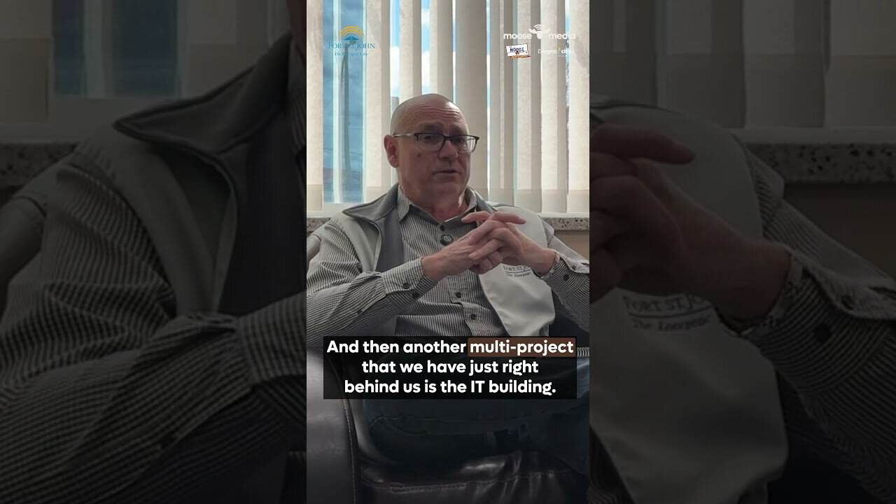 Man discussing upcoming council projects in the IT building for 2026.