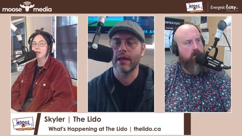 Radio hosts Skyler and guests speaking into microphones during The Lido show.