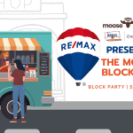 Moose FM block party with food trucks and attendees on 100th street.