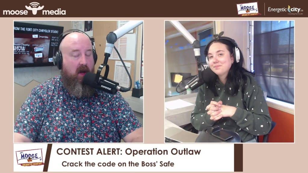 Radio hosts recording a show at MooseMedia studio in Fort St. John.