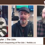Skyler, the host, speaking into a microphone during a podcast recording at The Lido Theatre.