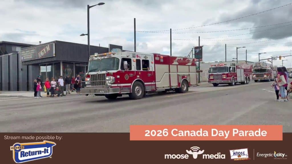 Fire trucks parade during 2026 Canada Day celebration in Moose Jaw.