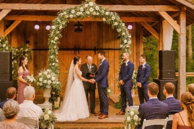 Elegant outdoor mountain wedding ceremony at Mountain Harbour venue with scenic natural beauty.