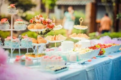 Colorful outdoor dessert table at Mountain Harbour event venue, perfect for celebrations and gatherings.