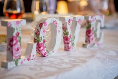 Bridal shower love letter decoration with floral "LOVE" sign at Mountain Harbour lodge.