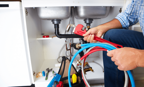 plumber fixing drainage issue