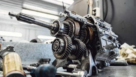 Close-up of a disassembled car transmission for repair and maintenance.