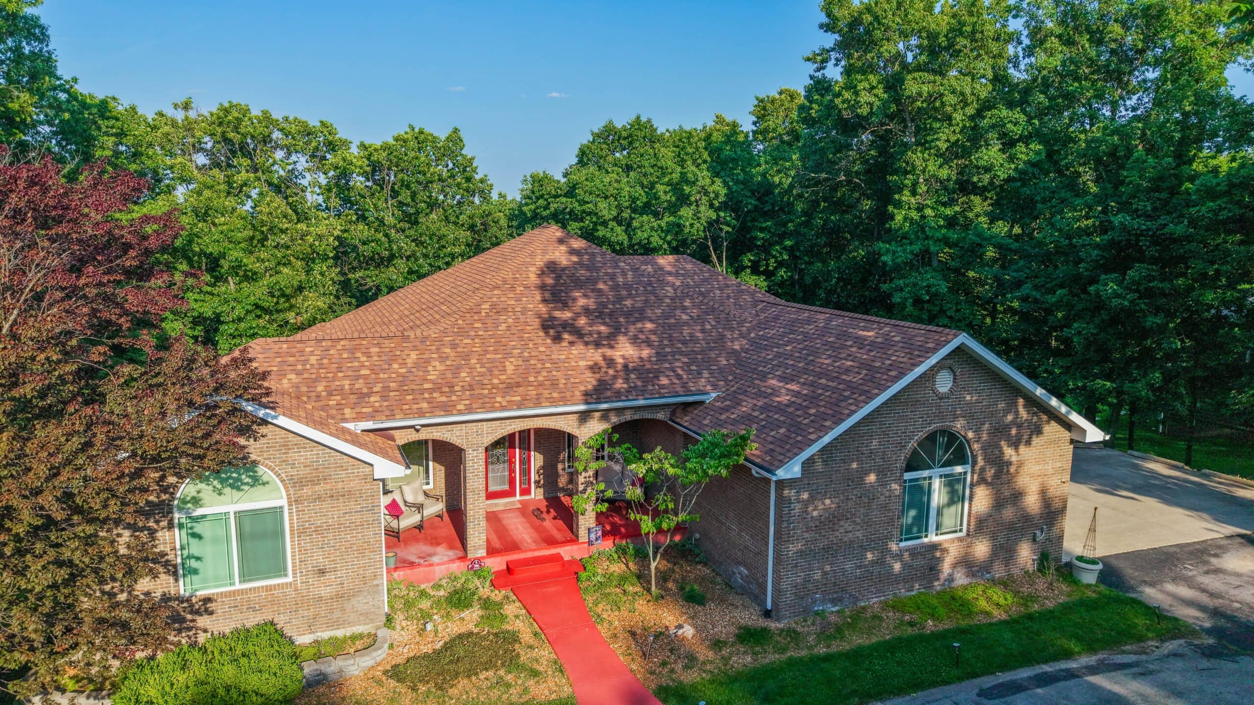A beautiful residential home with a new roofing system by Midwest Roofing.
