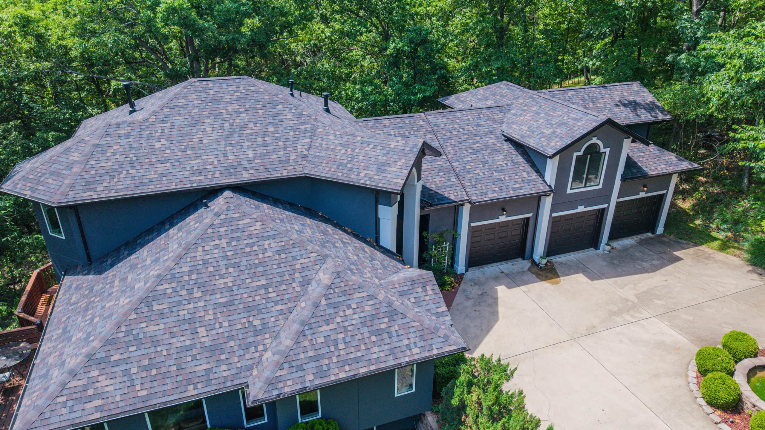 Aerial view of Midwest Roofing residential home with new asphalt shingle roof.