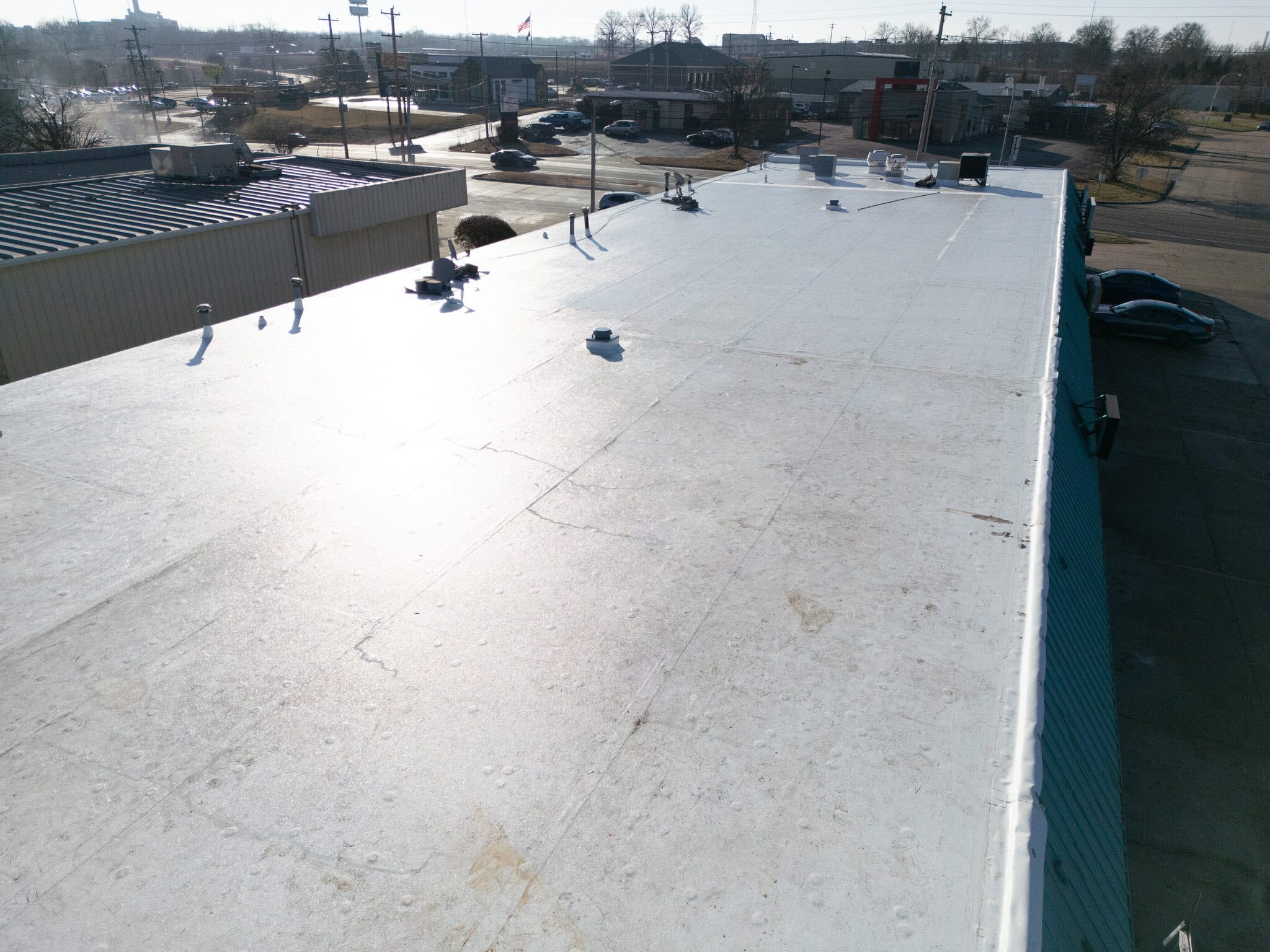 Flat commercial roof with roofing materials in Columbia, MO.
