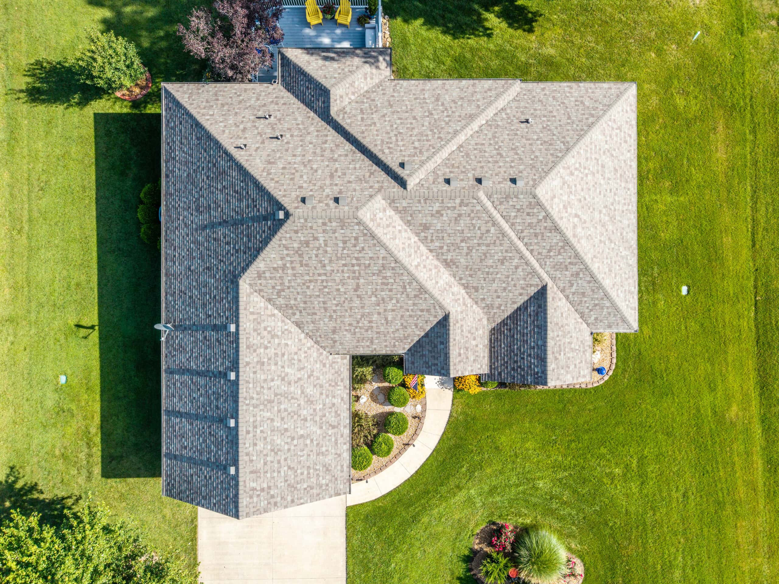 Aerial view of a house with new roofing in Lebanon, Missouri.