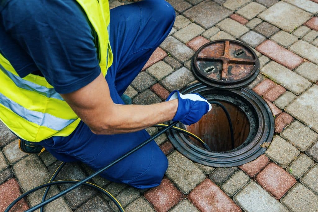 Bison Plumbing sewer drain repair service in Warren, MI — licensed plumbers diagnosing sewer line problems