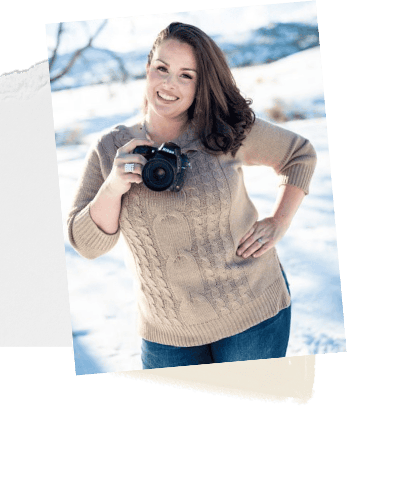 Professional outdoor winter photographer holding a DSLR camera, woman smiling in snowy landscape, capturing high-quality nature and portrait images, expert photography services.