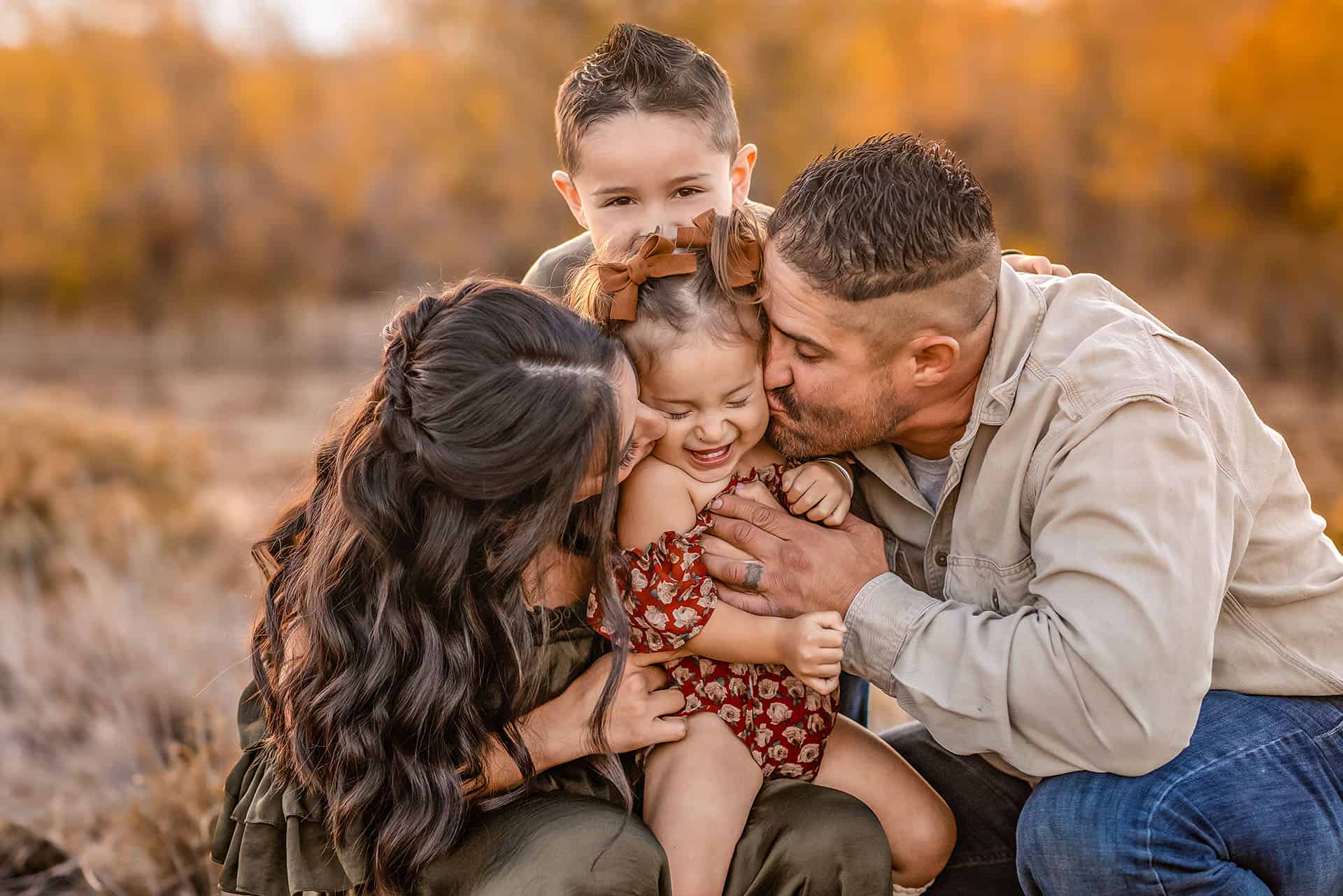 Family portrait celebrating love and togetherness, capturing joyful moments among parents and children in an outdoor autumn setting. Perfect for family photography and portrait sessions.