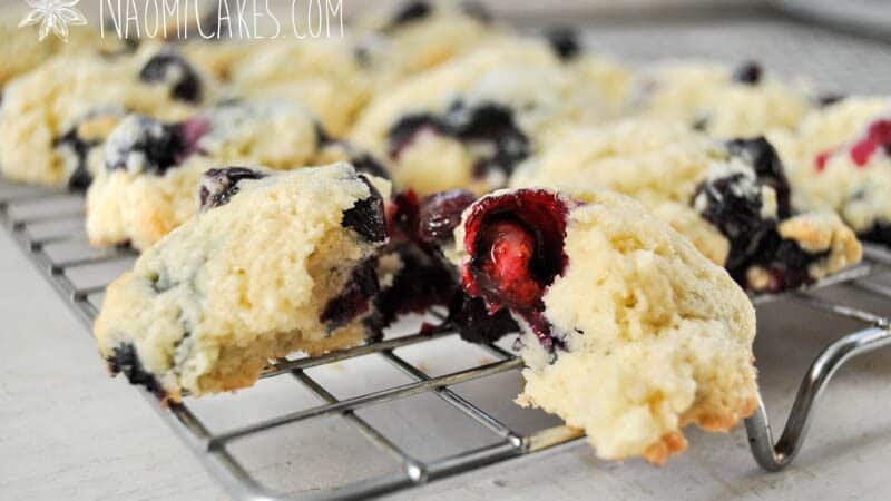 broken open blueberry scone on a cooling rack