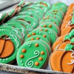 rows of beautiful fall sugar cookies with a pumpkin theme