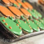 round sugar cookies with pumpkin and fall designs on them