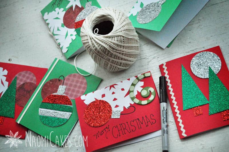 assorted homemade Christmas cards with string and a sharpie