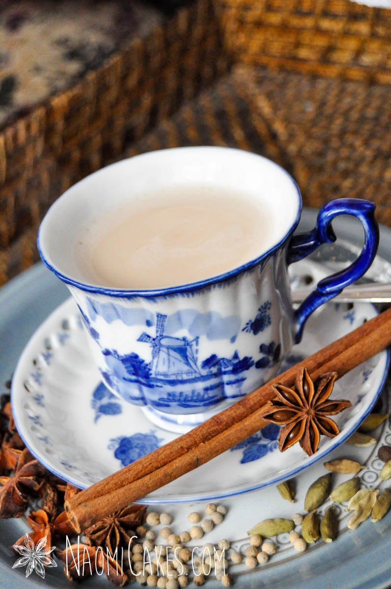 blue china tea cup of chai tea with cinnamon stick and star anise