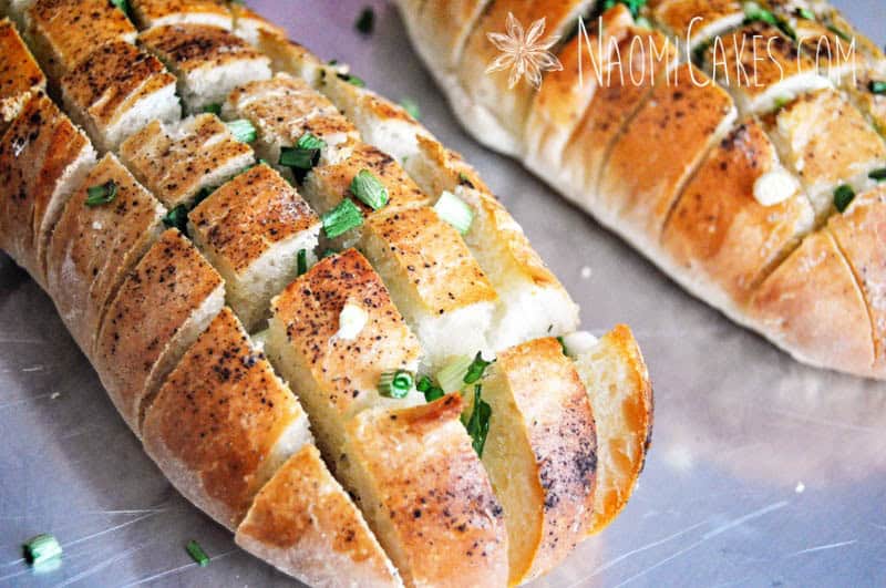 loaf of garlic bread stuffed with green onions
