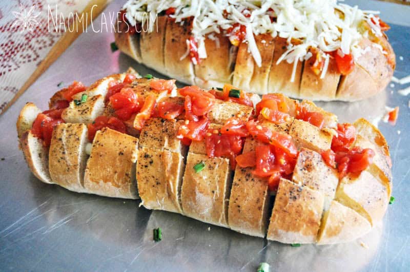 loaf of bread stuffed with diced tomatoes