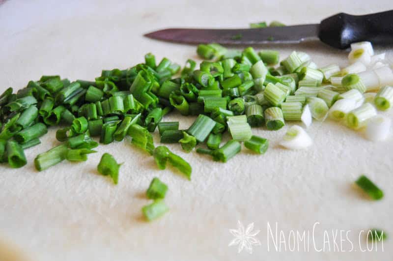 chopped green onions on a cutting board